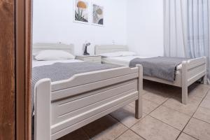 Posteľ alebo postele v izbe v ubytovaní Mike's Apartments