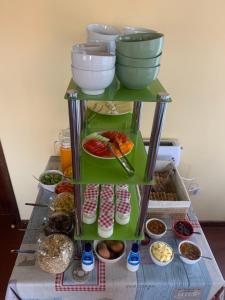 a shelf filled with lots of different types of food at Casa De Cha Prazeres in Prazeres