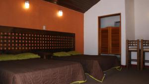 Letto o letti in una camera di Hotel Chapala Country