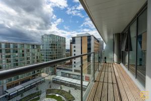 a balcony with a view of some buildings at Luxury 2-bed In central MK By Valore Property Services in Milton Keynes