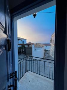 a balcony with a view of the ocean at Elaia House-Eλαία in Spetses