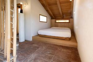 A bed or beds in a room at La Cucchetta