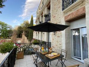 Балкон или терраса в Appart Hotel Spa Perpignan