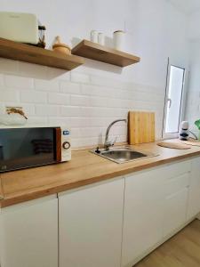 Una cocina o zona de cocina en Apartamento El Sereno