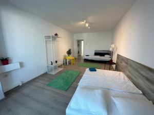 En eller flere senge i et værelse på green apartment 70