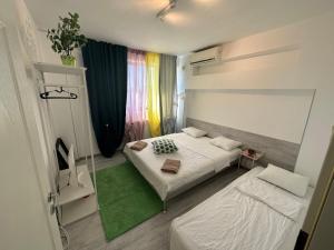 En eller flere senge i et værelse på green apartment 70