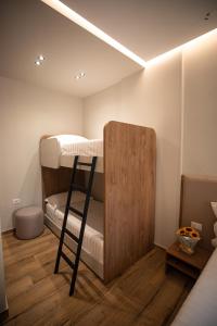 a room with two bunk beds and a ladder at Vlore Luxury Apartaments "FAEL" in Vlorë