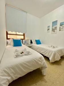 Katil atau katil-katil dalam bilik di Muy cómodo y cerca de la playa Supreme Puertito 7