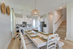 a kitchen and dining room with a table and chairs at Seas The Day Home with Pool Access in Galveston in Galveston