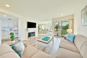 a living room with a couch and a table at Sunshine Fun Time in Newport Beach