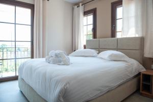 Ένα ή περισσότερα κρεβάτια σε δωμάτιο στο Lago Verde