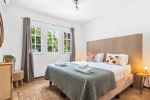 Postel nebo postele na pokoji v ubytování Casa Brasa Jan Thiel + 12 fotografií
