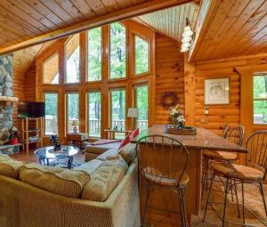 a living room with a couch and a table at Home Sweet Log in Wisconsin Dells