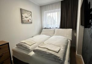 Postel nebo postele na pokoji v ubytování Penzión Oázis + 8 fotografií