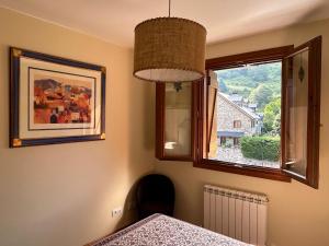 Postel nebo postele na pokoji v ubytování Sallent de Gállego - Formigal - Pirineos Sur