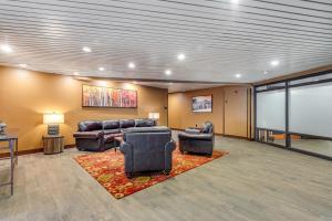 a large room with leather furniture and a screen at Mountain Plaza Base Camp in Copper Mountain +31 photos