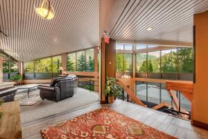 an open living room with a couch and a table at Mountain Plaza Base Camp in Copper Mountain