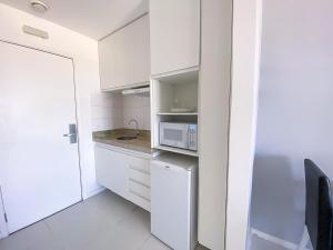 Η κουζίνα ή μικρή κουζίνα στο Flat Particular Vision com Vista Panorâmica Central - 15º andar +14 φωτογραφίες