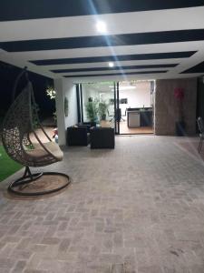 a lobby with a chair and a living room at Casa de Silvares in Celorico de Basto