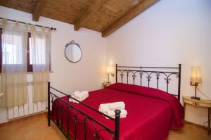 Giường trong phòng chung tại Residence Villarcangelo