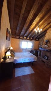 a bedroom with a large bed in a room at Casa Rural El Labriego in Corral de Ayllón