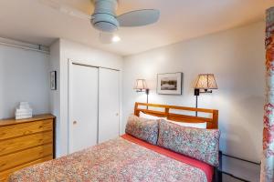 a bedroom with a bed and two lamps and a dresser at Mountainside Resort F401 in Stowe +72 photos