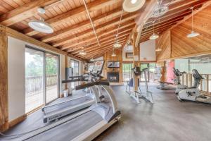 a gym with treadmills and elliptical machines at Mountainside Resort F401 in Stowe