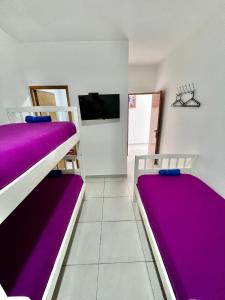 Posteľ alebo postele v izbe v ubytovaní Hostal Lumar