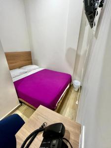 Posteľ alebo postele v izbe v ubytovaní Hostal Lumar
