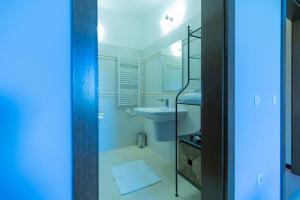 a white bathroom with a sink and a toilet at Luxury 2 bedroom villa in Sozopolis in Sozopol +26 photos