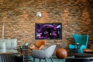 TV a/nebo společenská místnost v ubytování Motel One München-Garching
