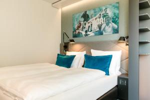 Postel nebo postele na pokoji v ubytování Motel One München-Garching