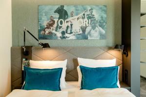 Postel nebo postele na pokoji v ubytování Motel One München-Garching