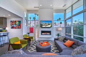 a living room with a couch and a fireplace at Stunning Palm Springs 2 Bedroom Condo in Palm Springs