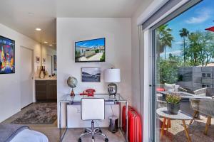 a home office with a desk and a window at Stunning Palm Springs 2 Bedroom Condo in Palm Springs