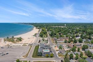 an aerial view of a beach and the ocean at Snyders Shoreline Inn in Ludington