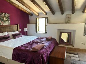 Ein Bett oder Betten in einem Zimmer der Unterkunft Cortijo Cuscurro