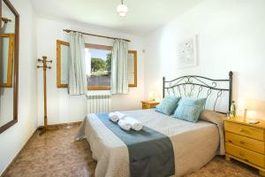 A bed or beds in a room at Villa Maria Celia by Villa Plus