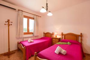 A bed or beds in a room at Villa Maria Celia by Villa Plus