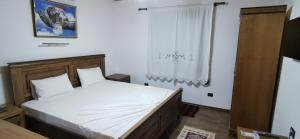 Ένα ή περισσότερα κρεβάτια σε δωμάτιο στο Hazmurat Hotel