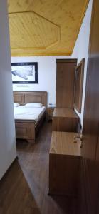Ένα ή περισσότερα κρεβάτια σε δωμάτιο στο Hazmurat Hotel