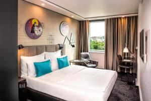 Posteľ alebo postele v izbe v ubytovaní Motel One Wien Westbahnhof