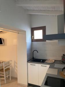 a kitchen with a sink and a counter top at Podere Casalino in Reggello