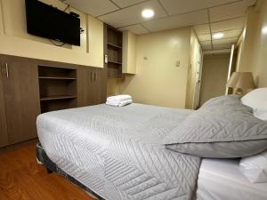Voodi või voodid majutusasutuse Hostal Posada Del Sol toas