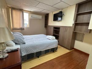 Voodi või voodid majutusasutuse Hostal Posada Del Sol toas