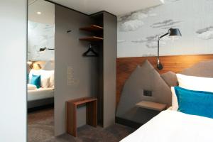 Ein Bett oder Betten in einem Zimmer der Unterkunft Motel One Zürich