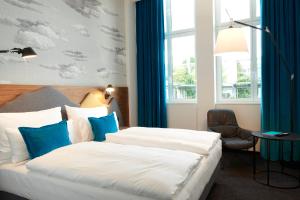 Ein Bett oder Betten in einem Zimmer der Unterkunft Motel One Zürich