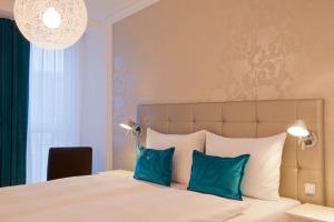 Postel nebo postele na pokoji v ubytování Motel One Wien-Staatsoper