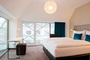 Postel nebo postele na pokoji v ubytování Motel One Wien-Staatsoper