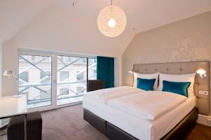 Postel nebo postele na pokoji v ubytování Motel One Wien-Staatsoper